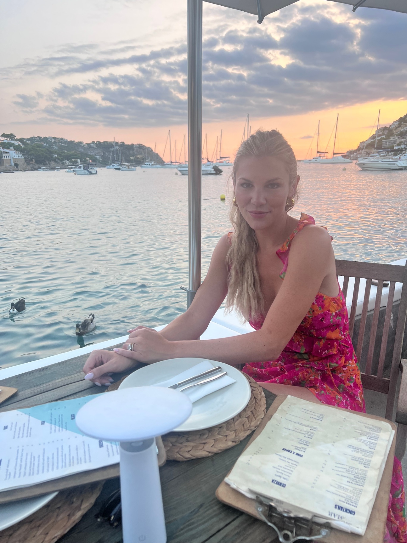 Alana Gardiner overlooking a Mallorcan harbor at sunset